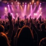 A congregation worshipping with hands raised at a night of worship